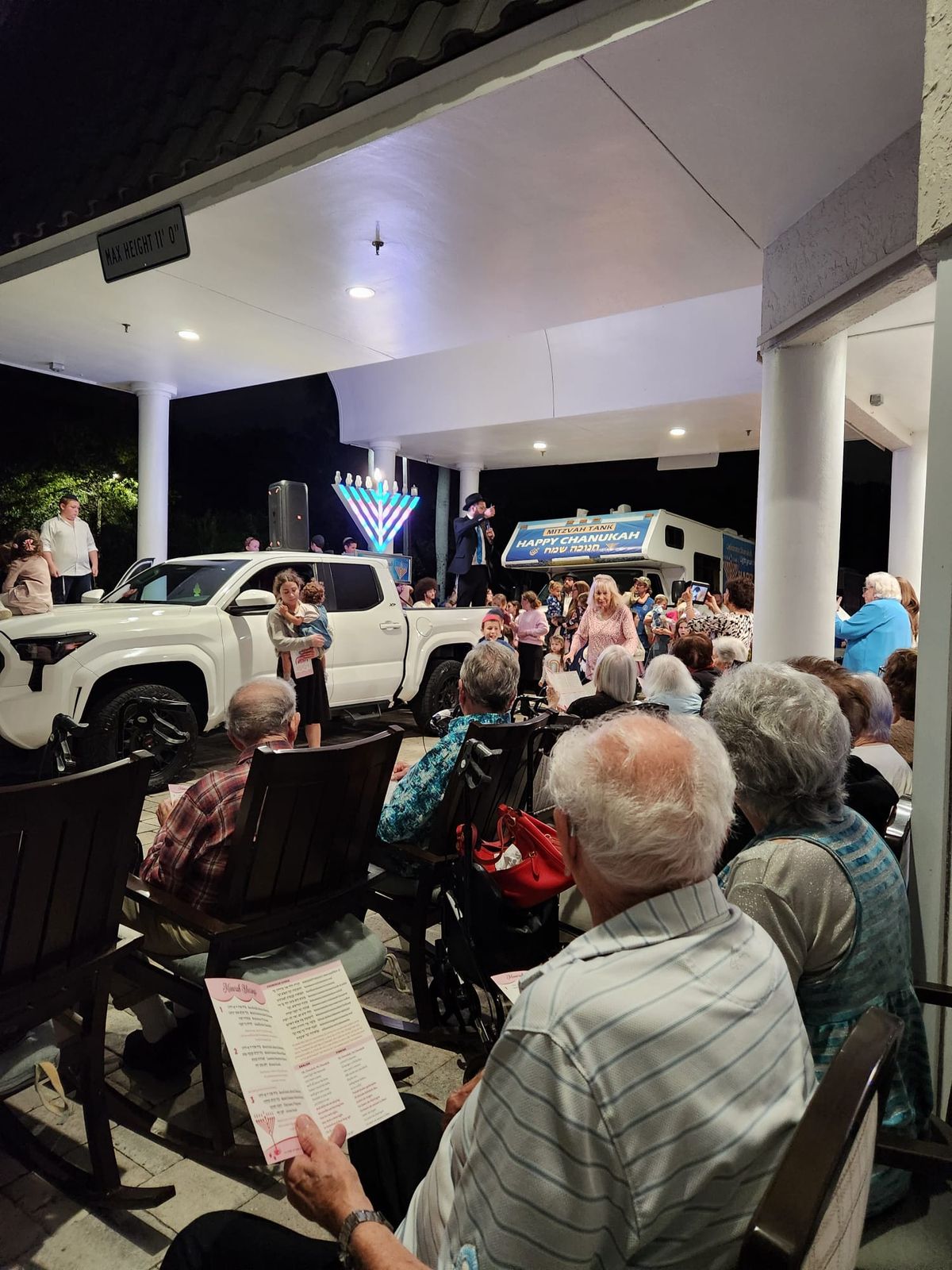 Menorah lighting on a senior home patio